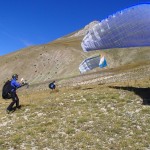 Markus and Jakob handling their wings up the hill